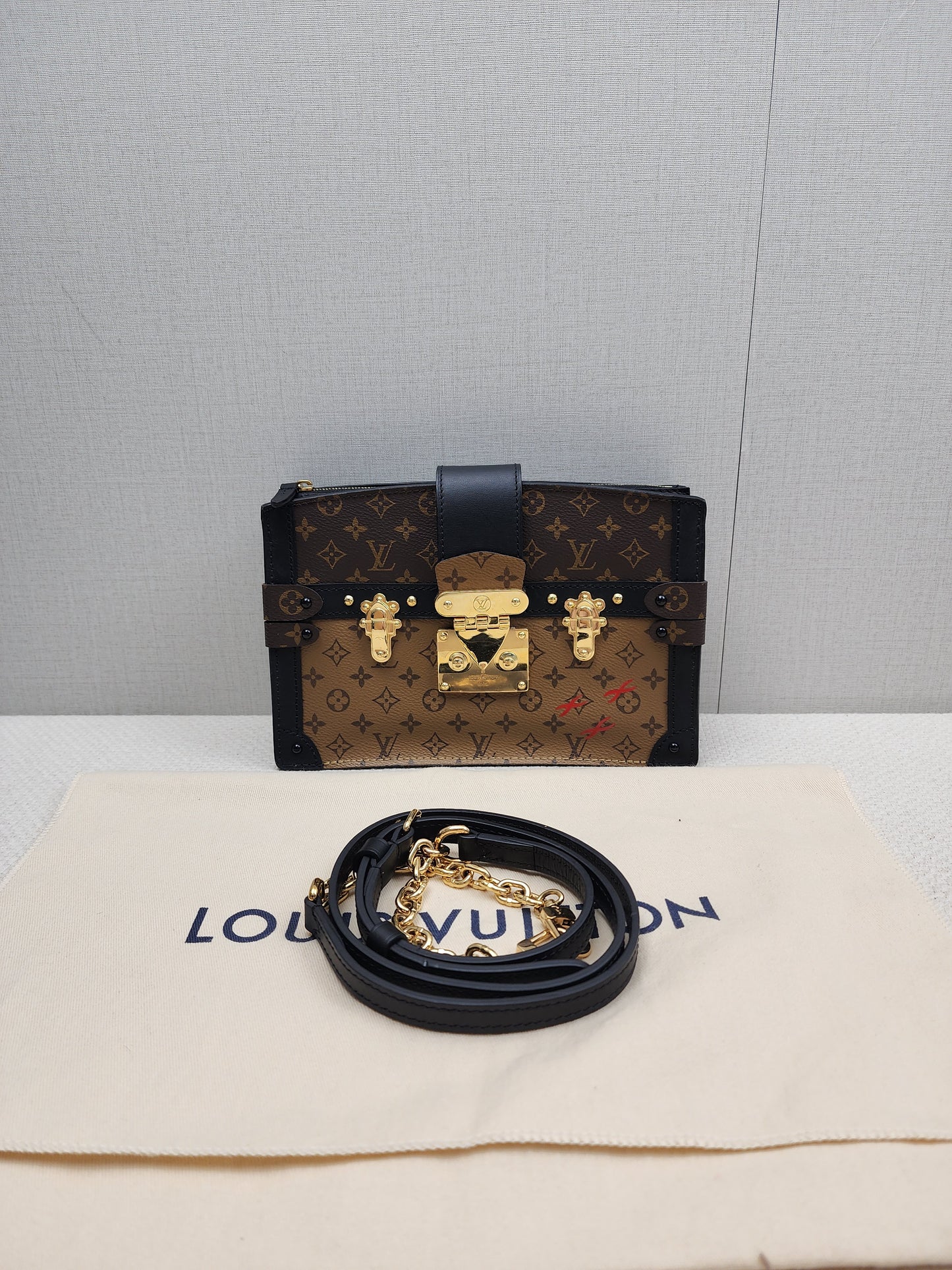 LV Reverse Monogram Trunk Clutch on Chain
