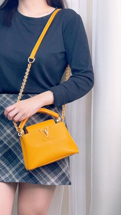 Louis Vuitton Ocre Yellow Taurillon Mini Capucines